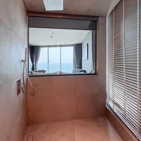 M Hotel Danang Exterior photo A shower with a fixed shower head and a handheld shower head