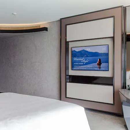 M Hotel Danang Exterior photo A television in a hotel room